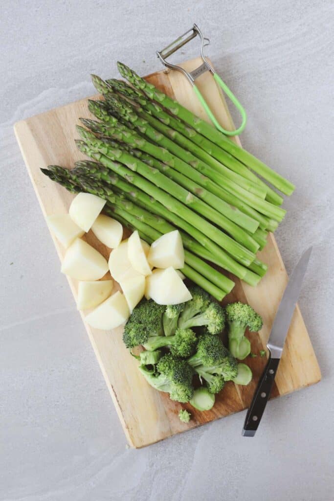 peeled and chopped potatoes, peeled asparagus and chopped broccoli