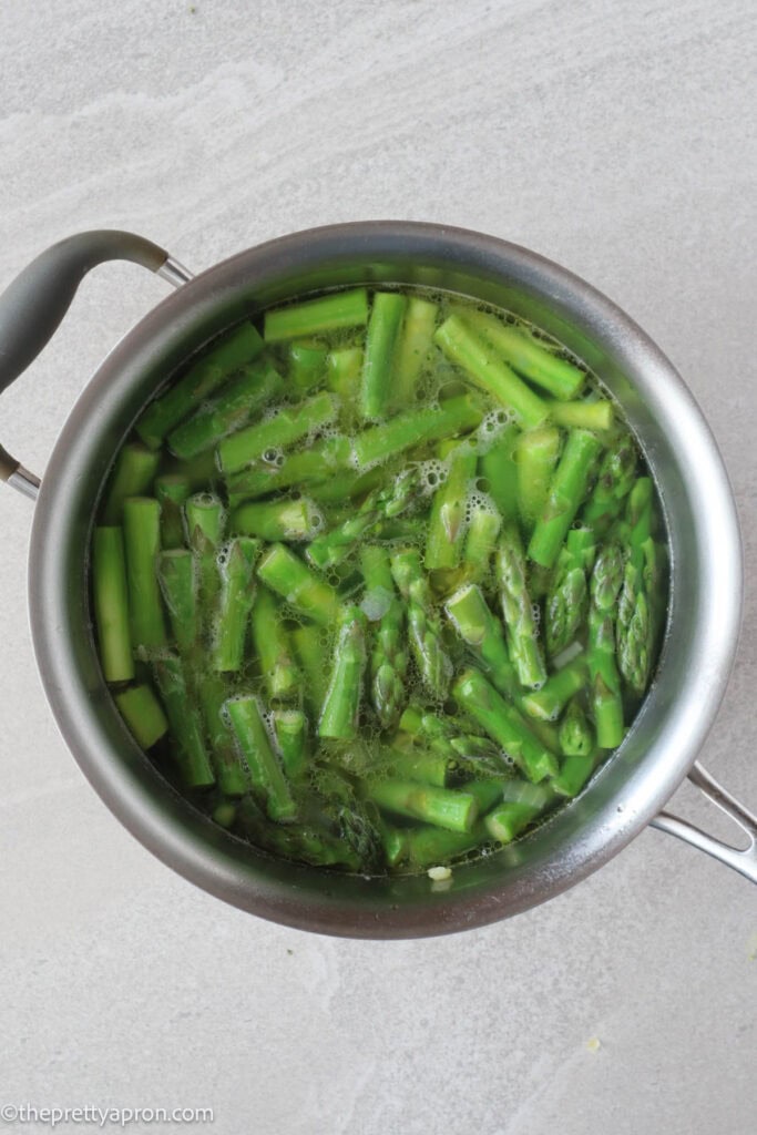 asparagus boiling in soup pot