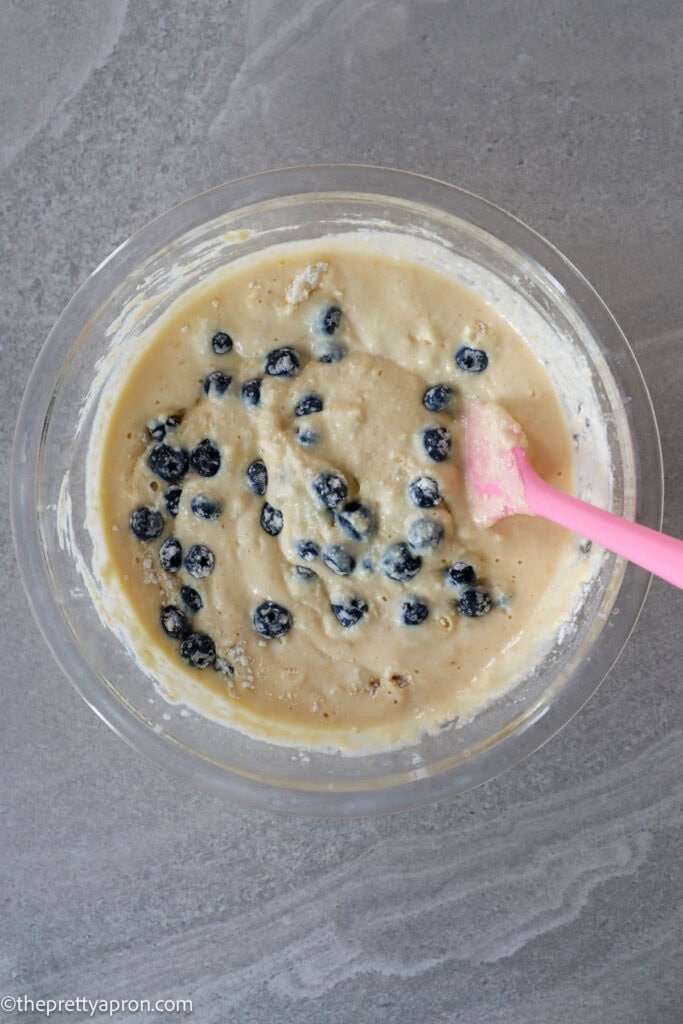 Blueberries folded into lemon ricotta blueberry pancake batter