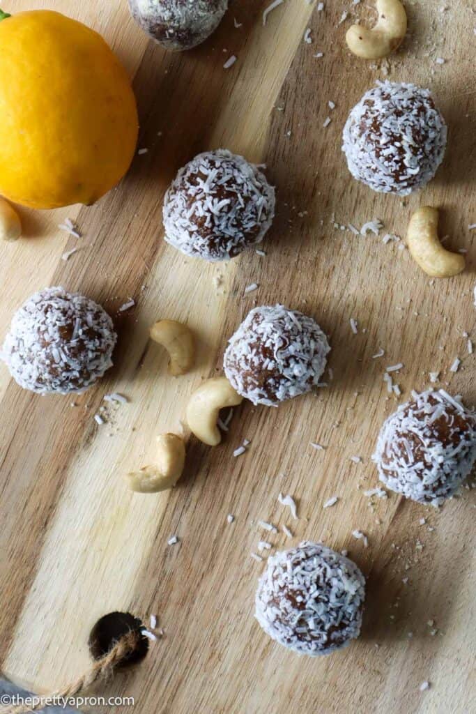 Lemon bliss balls on wooden board