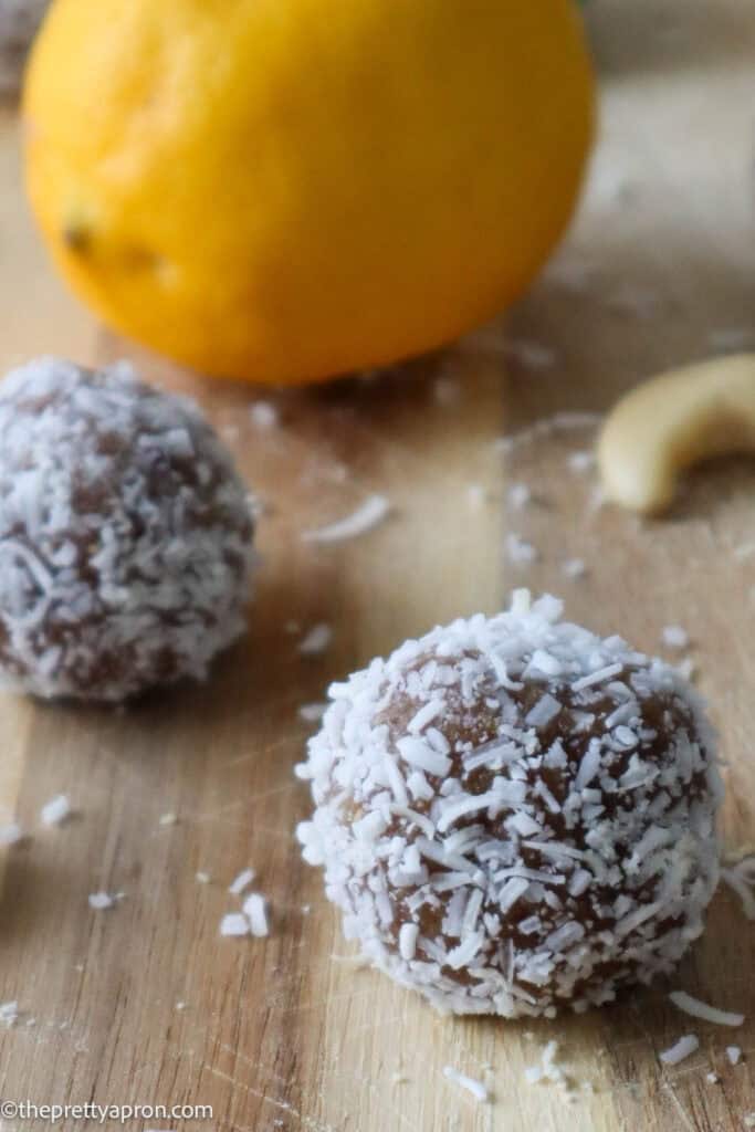 lemon balls with lemon on wooden board