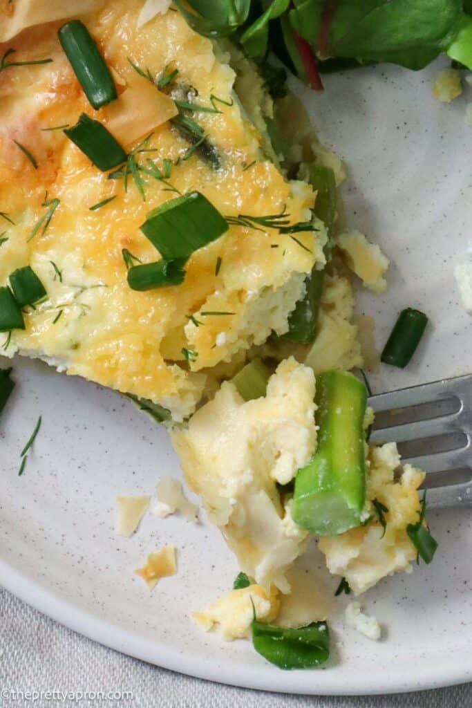 Forkful of asparagus ricotta quiche