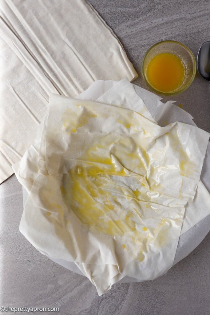 Pie dish with two sheets of phyllo dough on top