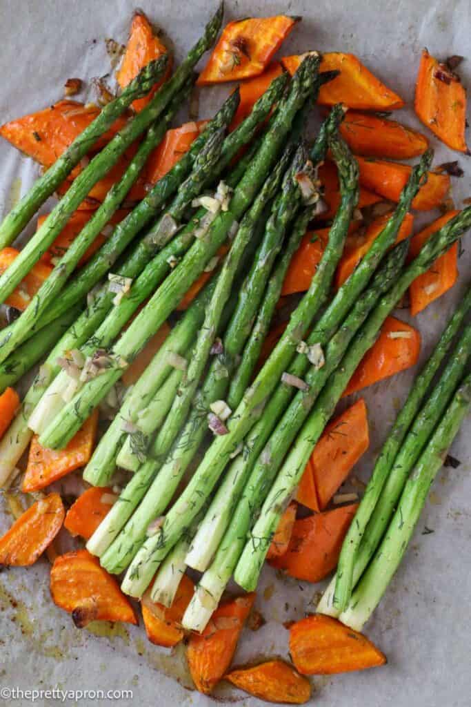 Roasted asparagus and carrots on parchment paper