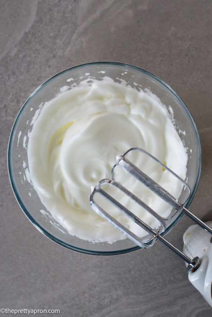 whipped egg whites in a bowl 